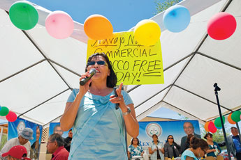 Patricia Nez Henderson of the Southwest Navajo Tobacco Education and Prevention Project welcomes a crowd to the Navajo Nation Commercial Tobacco Free Day event in Window Rock Tuesday. &copy; 2011 Gallup Independent / Cable Hoover 